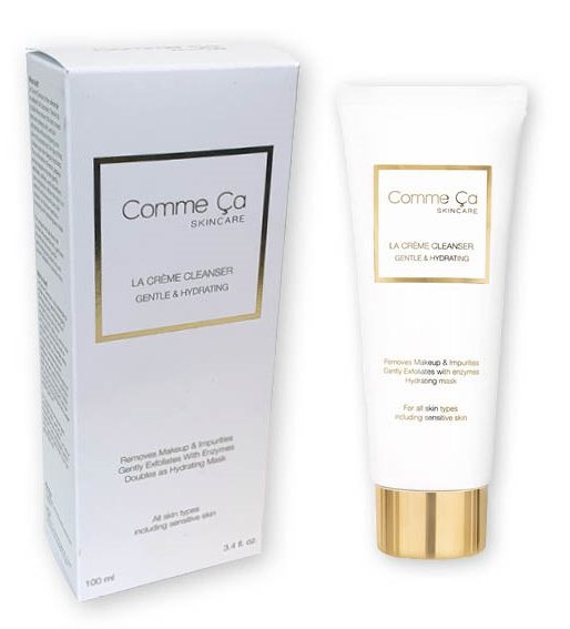 Een premium wit bedrukt cosmetica doosje op maat en een bijbehorende 100 ml tube Comme Ça Skincare La Crème Cleanser. Het doosje is vervaardigd uit mat helderwit karton en voorzien van een luxe goudfolie opdruk rondom het logo en de productnaam, wat zorgt voor een exclusieve uitstraling. De tube heeft een bijpassende gouden dop en strakke zwarte typografie. Deze professionele verpakking illustreert de mogelijkheid om voor reinigers en andere verzorgingsproducten een perfect passend bedrukt doosje te ontwerpen dat direct in het oog springt en de merkwaarde verhoogt. luxe bedrukt cosmetica doosje voor 100 ml tube cleanser met logo in goud folie opdruk