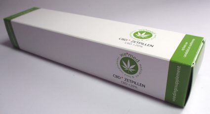 bedrukte doos voor zetpil cbd olie supplement in groen met logo